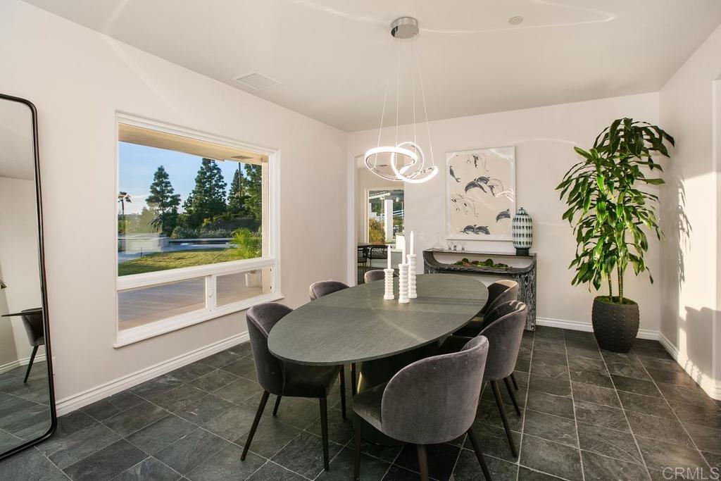 3325 Jasmine Crest Encinitas, CA 92024 - Photo 15 of 45 a view of a dining room with furniture and a potted plant