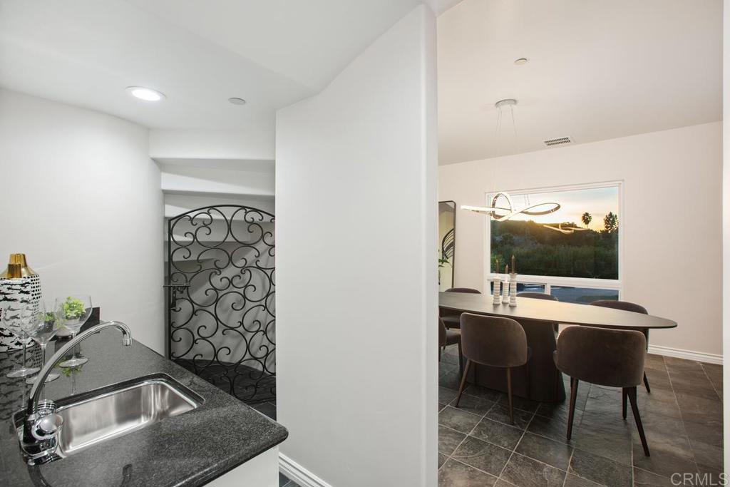 3325 Jasmine Crest Encinitas, CA 92024 - Photo 16 of 45 a room with furniture and flat screen tv