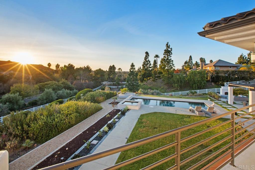 3325 Jasmine Crest Encinitas, CA 92024 - Photo 22 of 45 a view of a tennis court with a table and chairs