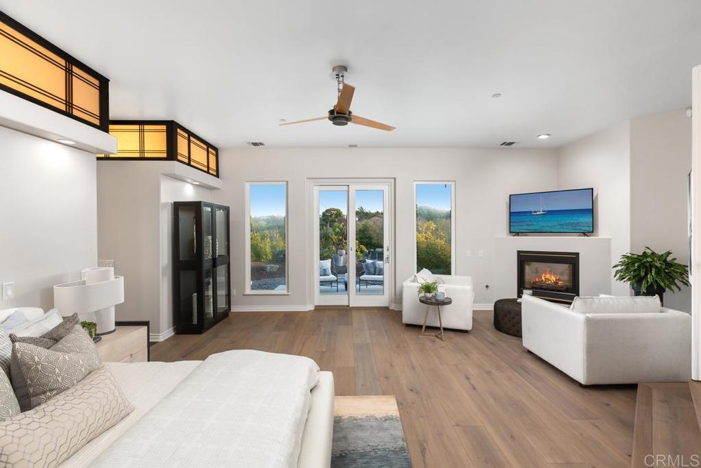 3325 Jasmine Crest Encinitas, CA 92024 - Photo 25 of 45 a living room with furniture fireplace and potted plant