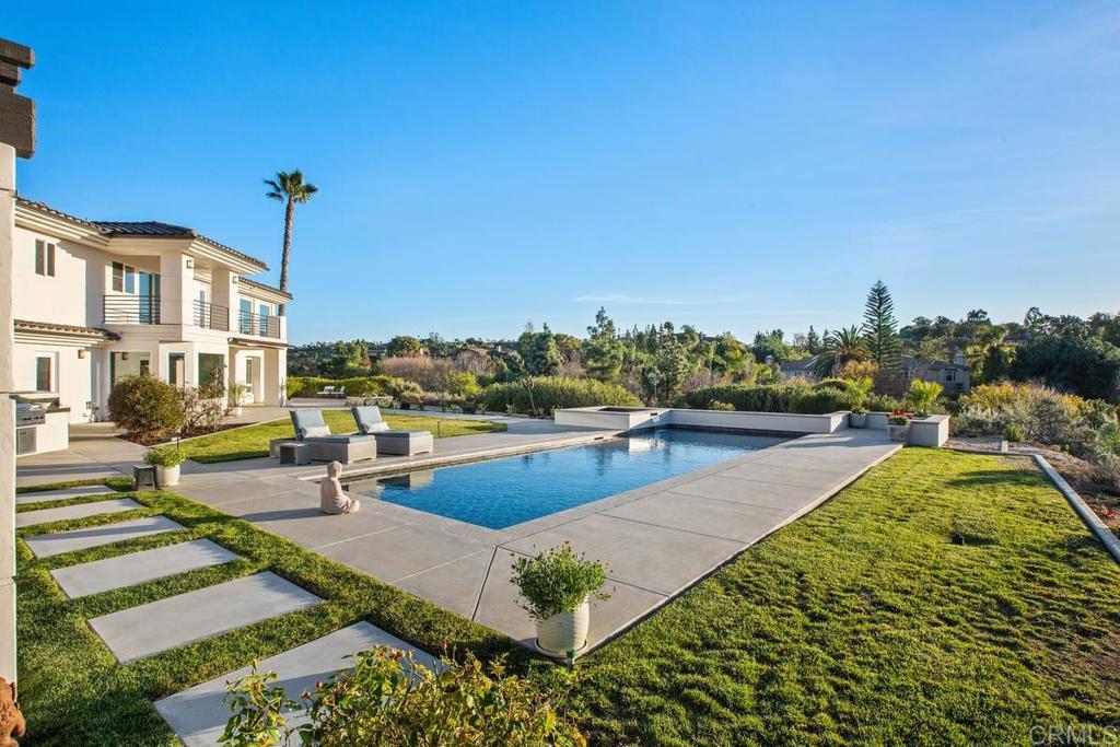 3325 Jasmine Crest Encinitas, CA 92024 - Photo 30 of 45 a view of a swimming pool with a lounge chair