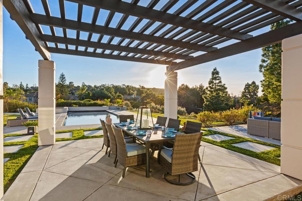 3325 Jasmine Crest Encinitas, CA 92024 - Photo 33 of 45 a dining space with furniture and city view