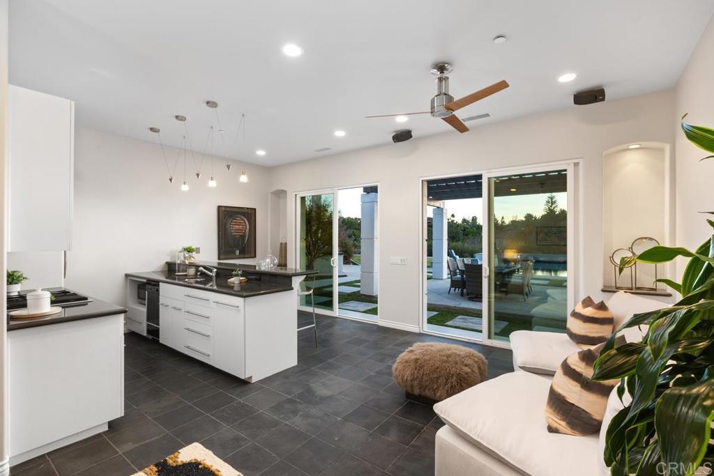 3325 Jasmine Crest Encinitas, CA 92024 - Photo 36 of 45 a living room with stainless steel appliances furniture and a large window