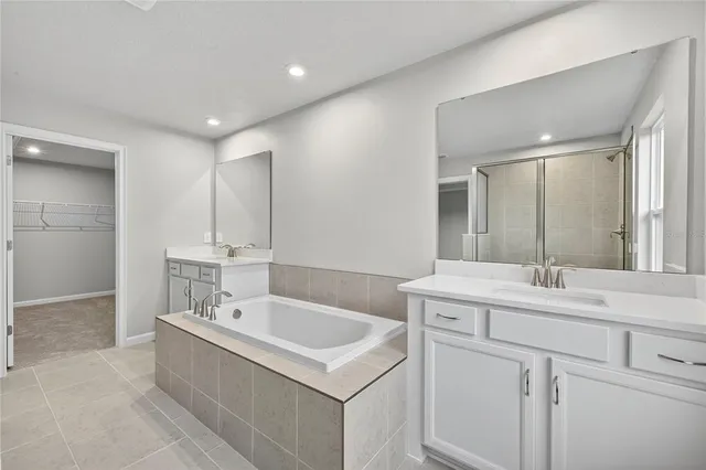 a bathroom with a shower and a glass door