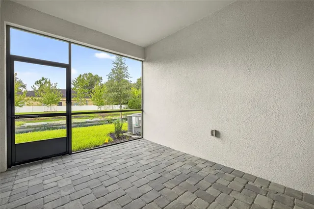 a view of a house with backyard porch and sitting area