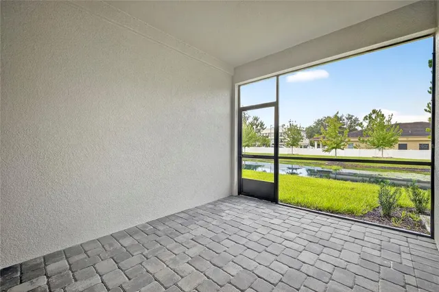 a view of a chairs and table in the patio
