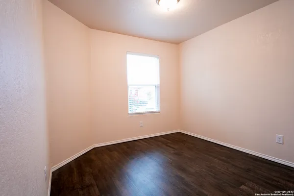 a large kitchen with stainless steel appliances granite countertop a refrigerator and a stove top oven