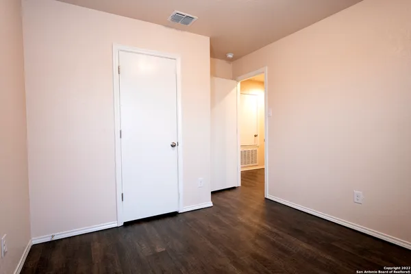 a kitchen with a refrigerator and a sink