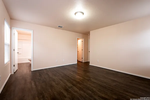 a view of an empty room with a balcony