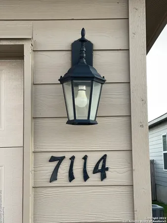 a view of a hallway view with wooden floor and staircase