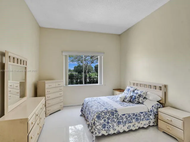 a bedroom with a bed and a cabinets