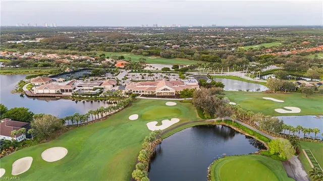 an aerial view of a pool residential houses with outdoor space