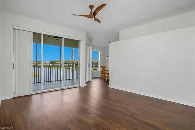 a view of a livingroom with wooden floor and a window