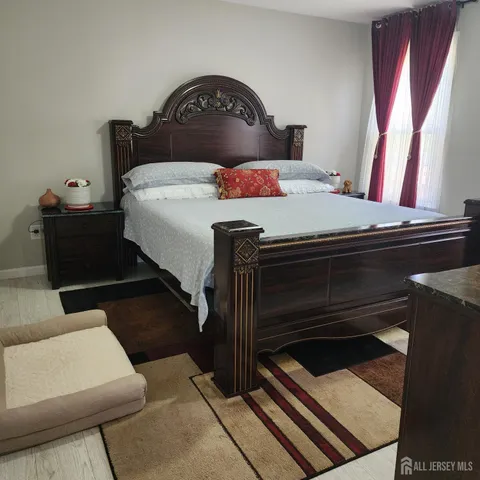 a bedroom with a bed and a dresser