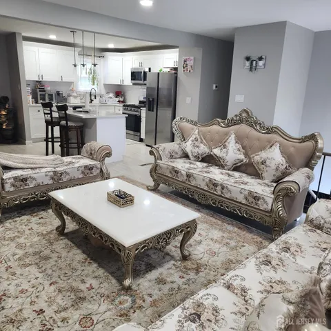 a living room with furniture and a table