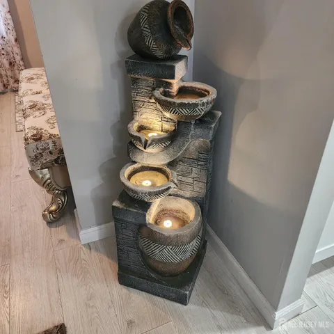 a living room with a couch and wooden floor