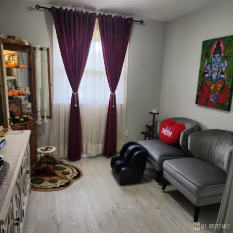 a bedroom with furniture and a bathtub