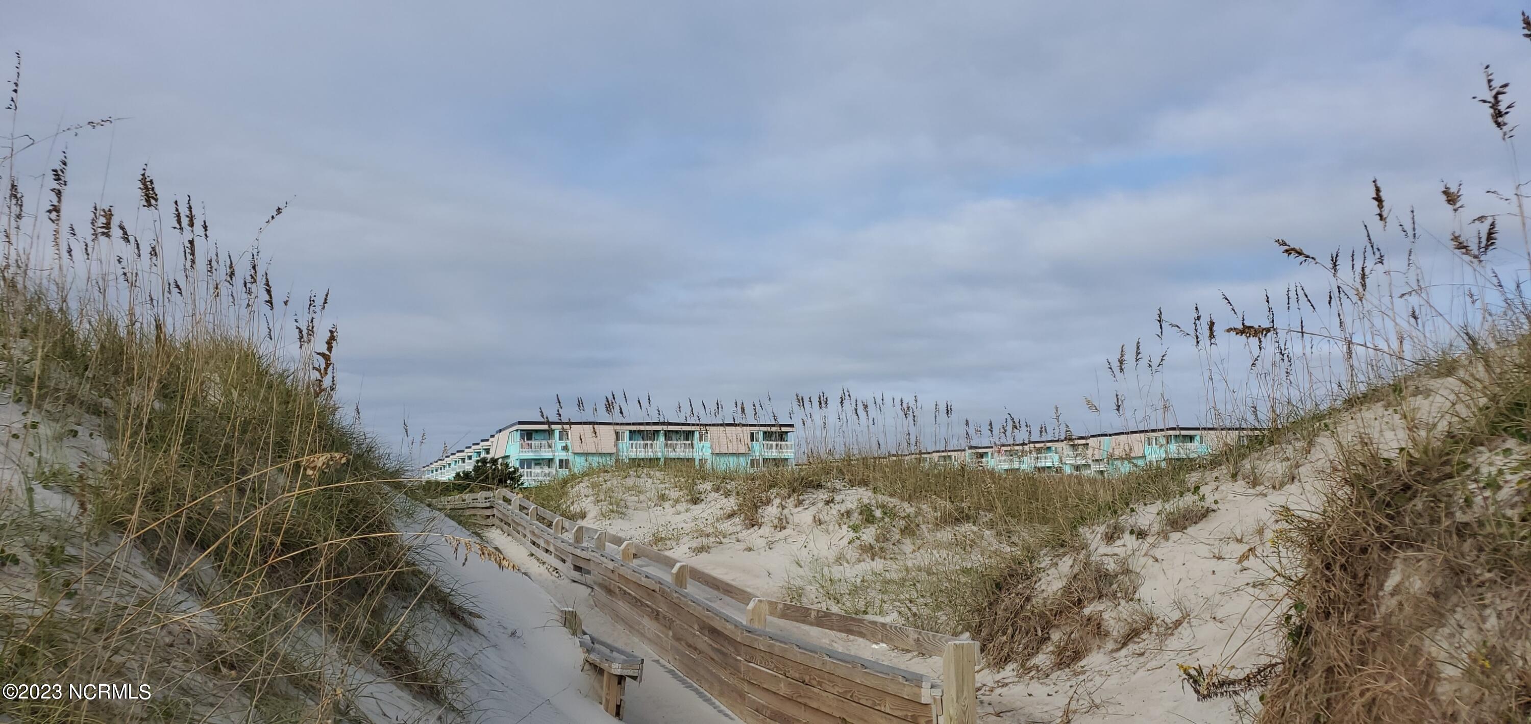 301 Commerce Way, Unit 346 Atlantic Beach, NC 28512 - Photo 10 of 36 View of building from the beach