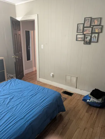 a bedroom with a bed and a table