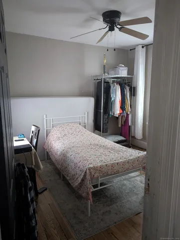 a bed room with a bed and a walk in closet