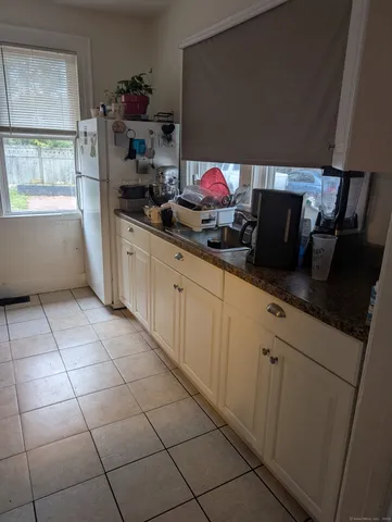 a kitchen with stainless steel appliances a sink dishwasher and cabinets