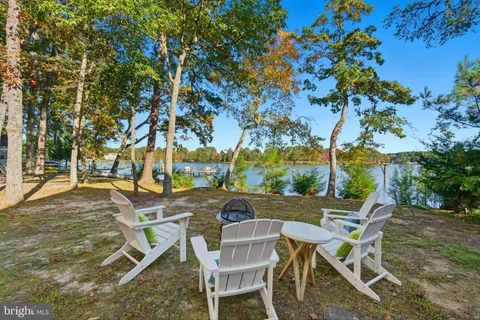 a view of a chairs and table in the patio