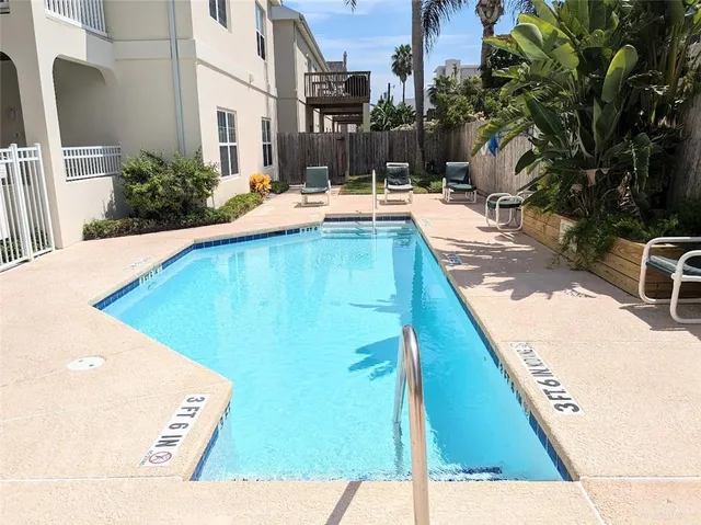 a view of a backyard with sitting area