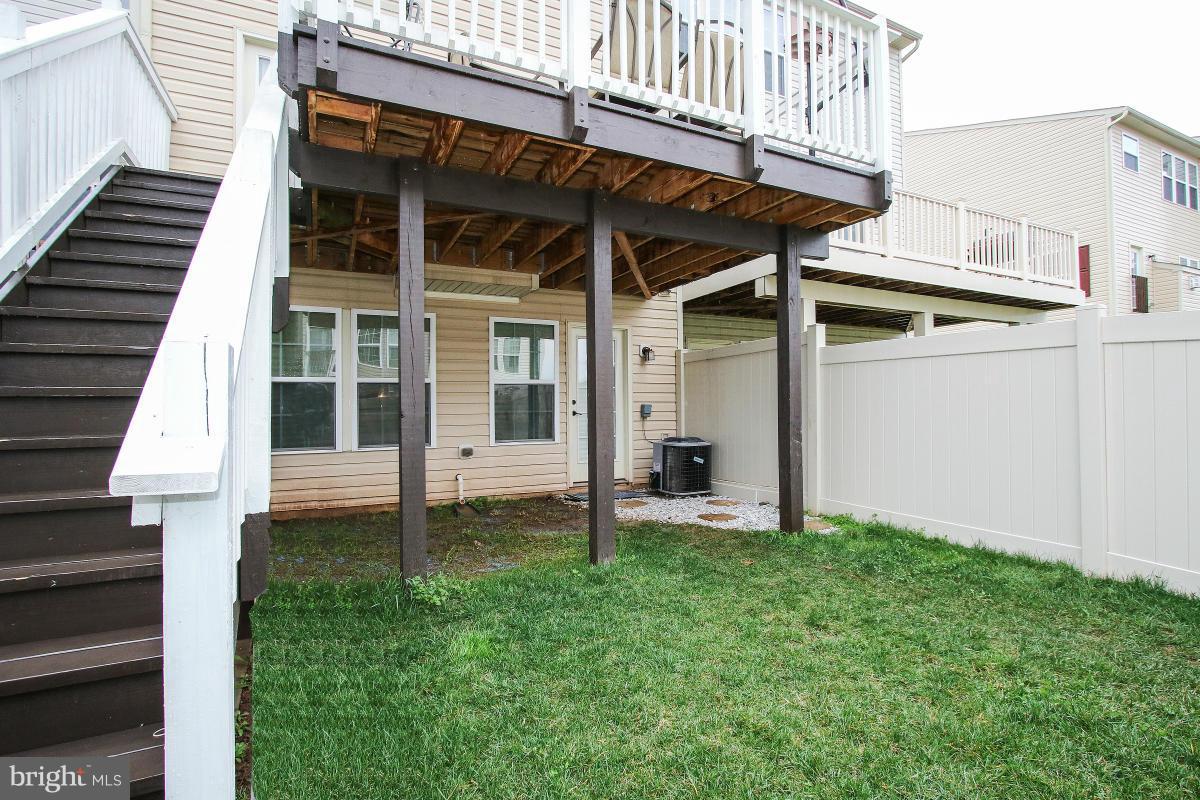 2062 Spring Run Circle Frederick, MD 21702 - Photo 27 of 30 Deck with Stairs + Patio w/ Fenced Back Yard