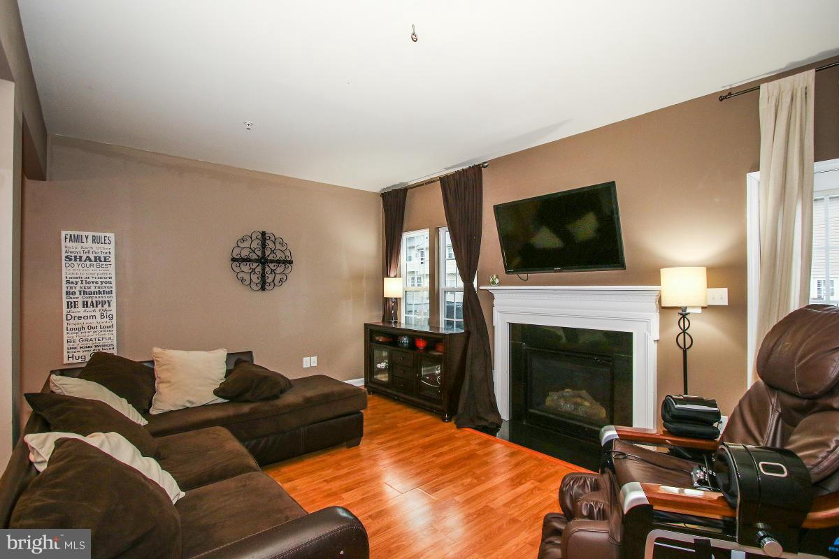 2062 Spring Run Circle Frederick, MD 21702 - Photo 10 of 30 Family Room w/ FP Opening to Deck