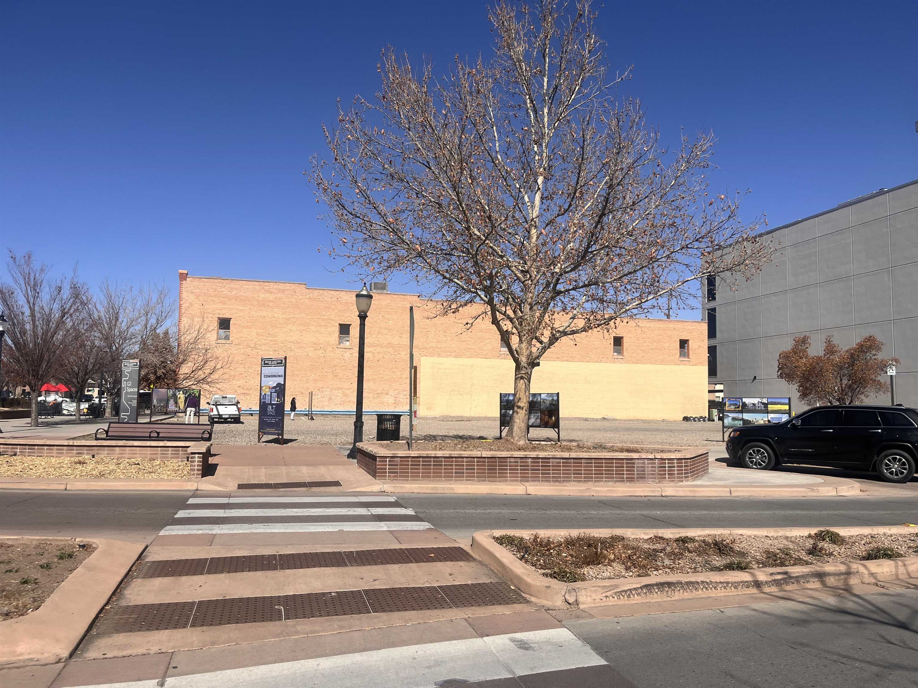702 Main Street Grand Junction, CO 81501 - Photo 3 of 7 a view of a street with a yard
