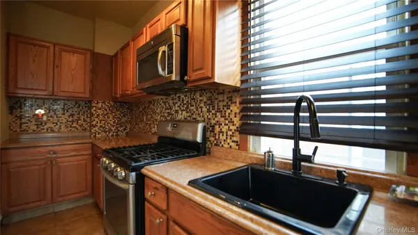a kitchen that has a stove and a sink