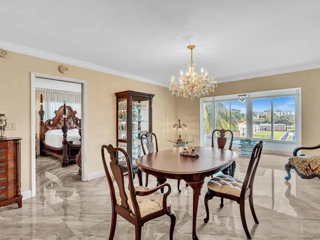 a bathroom with a granite countertop sink mirror and a bathtub