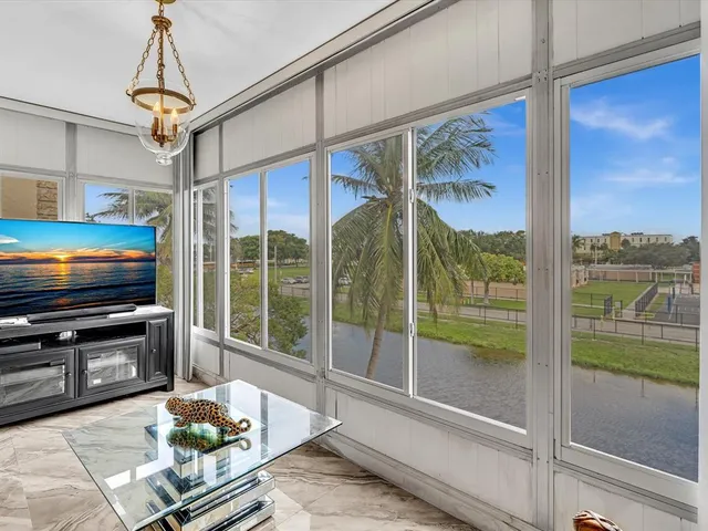 an aerial view of residential houses with yard