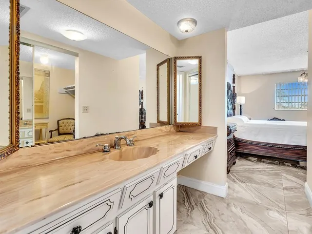 a view of a large building with a swimming pool