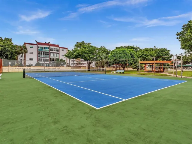 a room with lots of wooden table and chairs