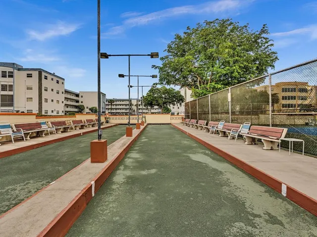 a view of a swimming pool with a lounge chairs