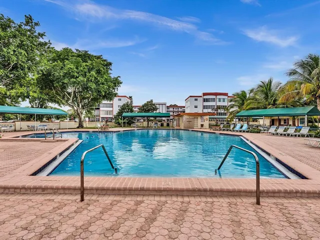 a room with gym equipment and floor to ceiling window