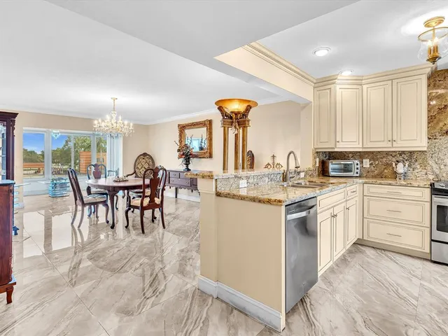 a kitchen with sink and cabinets