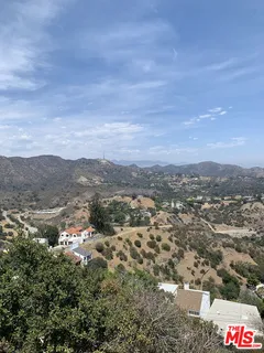an aerial view of residential house and green space