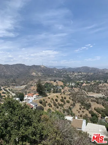 an aerial view of residential house and green space