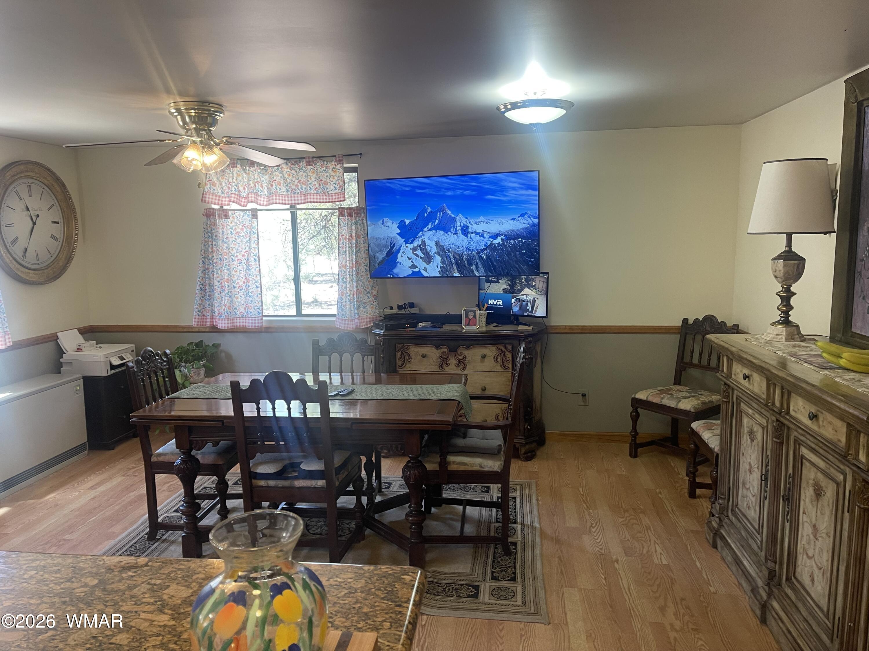2871 Moose Trail Overgaard, AZ 85933 - Photo 7 of 25 a view of a dining room with furniture a chandelier and wooden floor