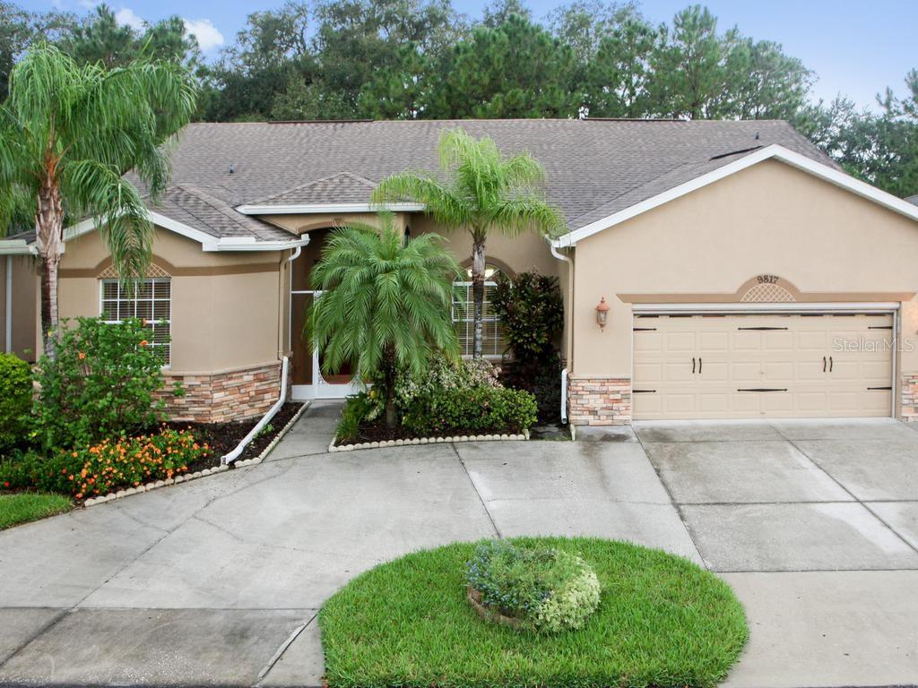 Lovely curb appeal, featuring a circular driveway!