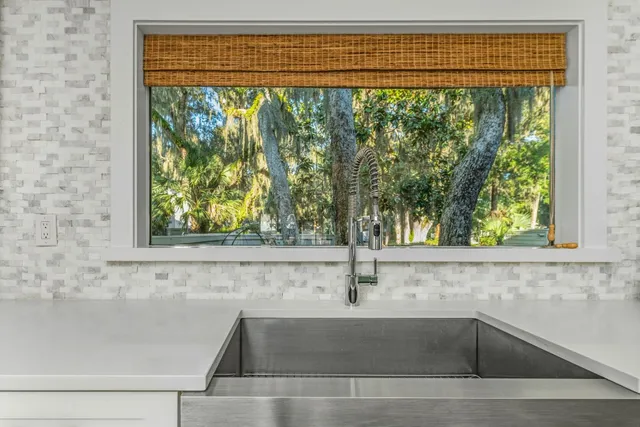 a view of a sink and wooden floor