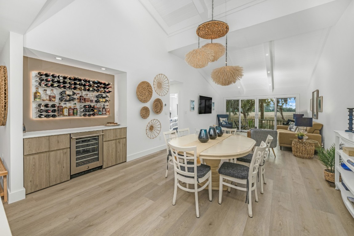3422 Sea Marsh Road Fernandina Beach, FL 32034 - Photo 13 of 42 a kitchen with stainless steel appliances kitchen island granite countertop a table and chairs in it