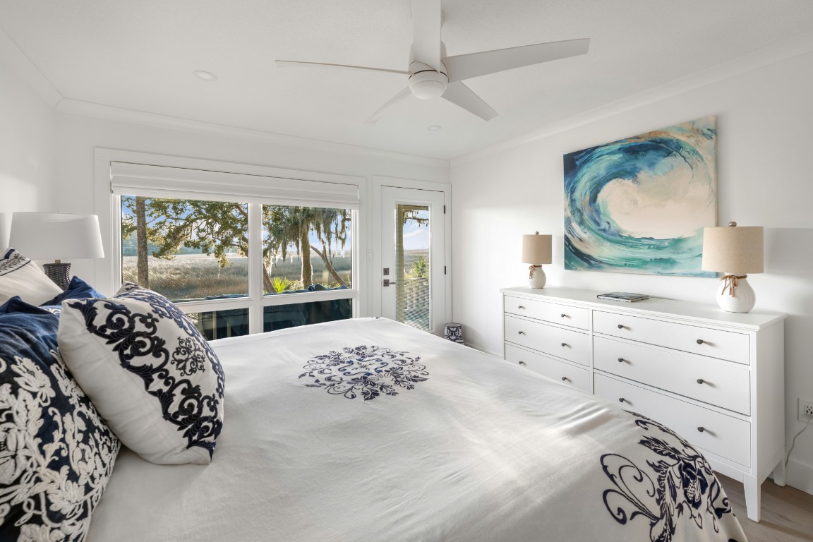 3422 Sea Marsh Road Fernandina Beach, FL 32034 - Photo 20 of 42 a bedroom with a large bed and a window