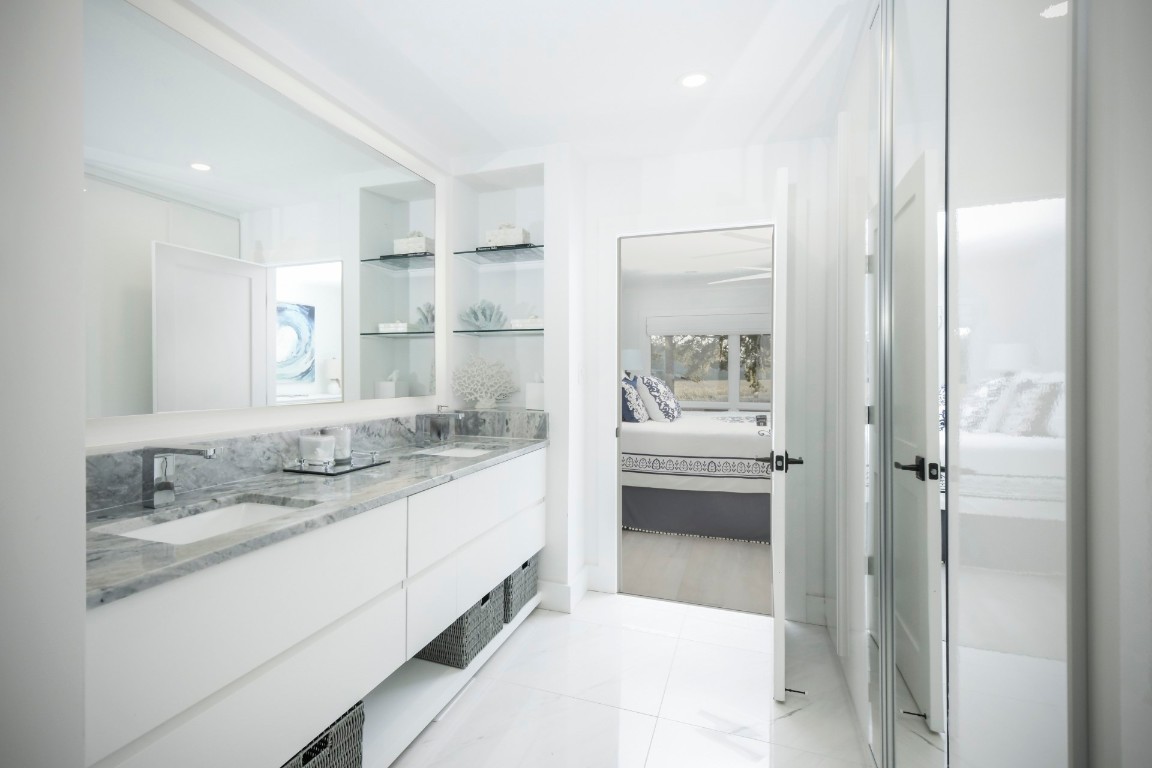 3422 Sea Marsh Road Fernandina Beach, FL 32034 - Photo 21 of 42 a bathroom with a granite countertop sink mirror and double