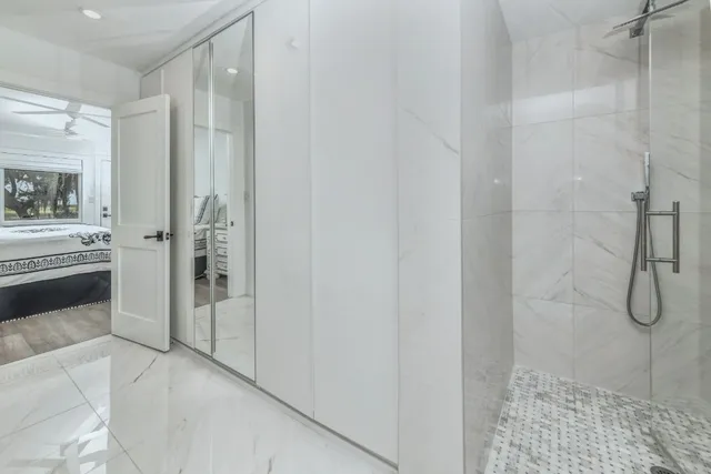 a bathroom with a shower and a sink