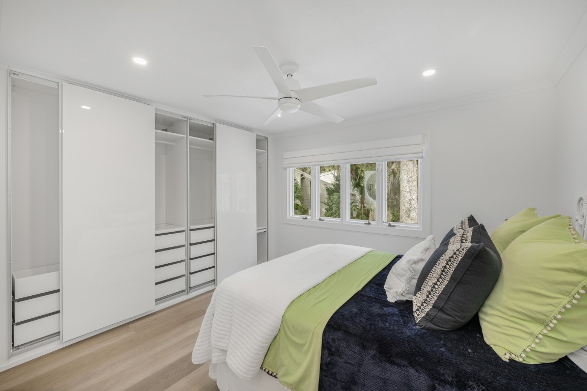 3422 Sea Marsh Road Fernandina Beach, FL 32034 - Photo 28 of 42 a bedroom with a bed and a window