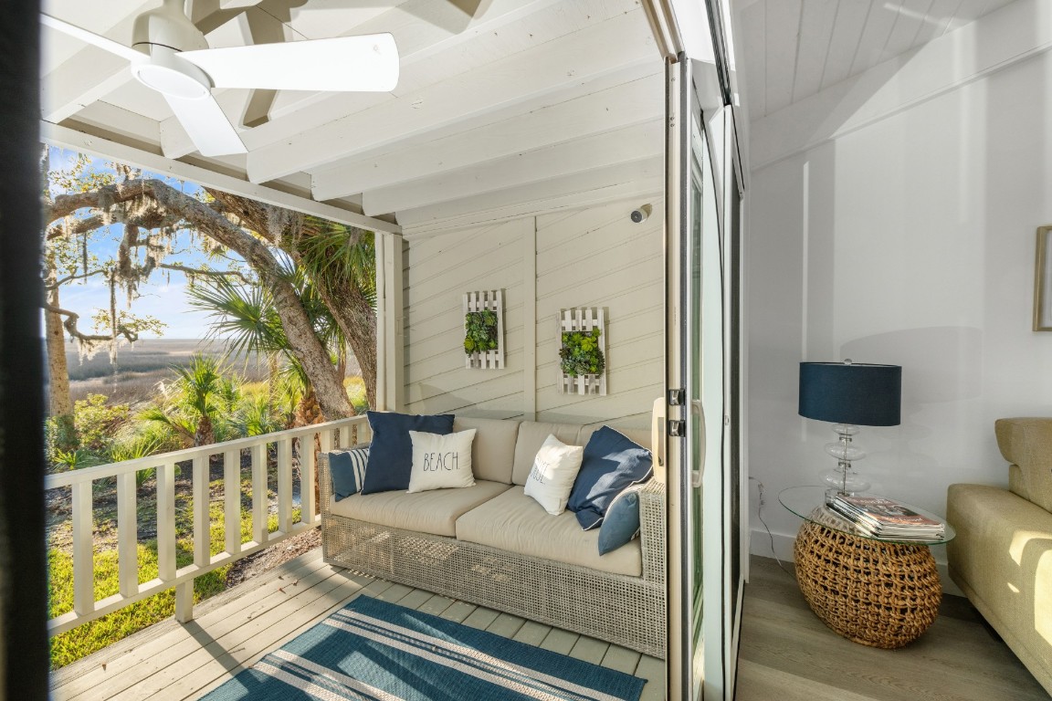 3422 Sea Marsh Road Fernandina Beach, FL 32034 - Photo 3 of 42 a living room with furniture and a flat screen tv