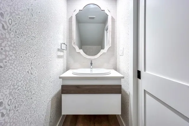 a bathroom with a sink and a mirror